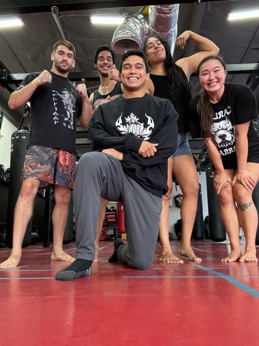 Coach Carlos with a training group at the gym