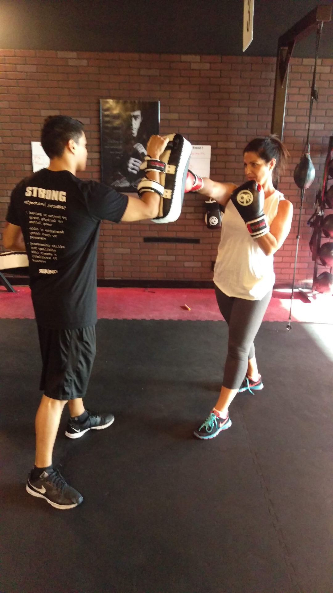 Kickboxing pad work during a coaching session