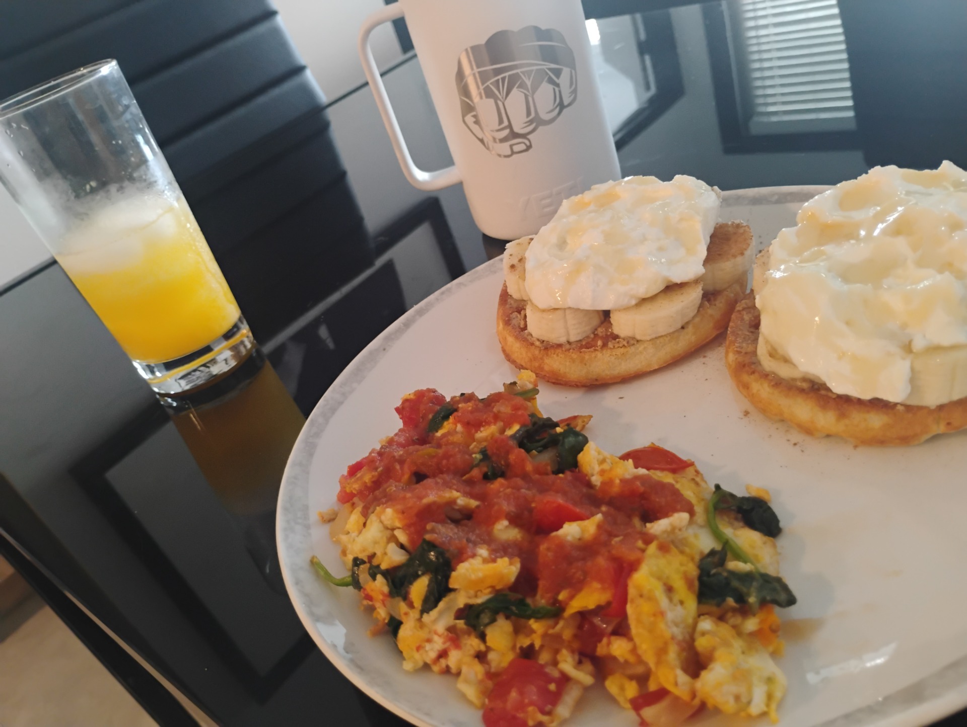 Balanced breakfast with eggs, vegetables, toast, and juice